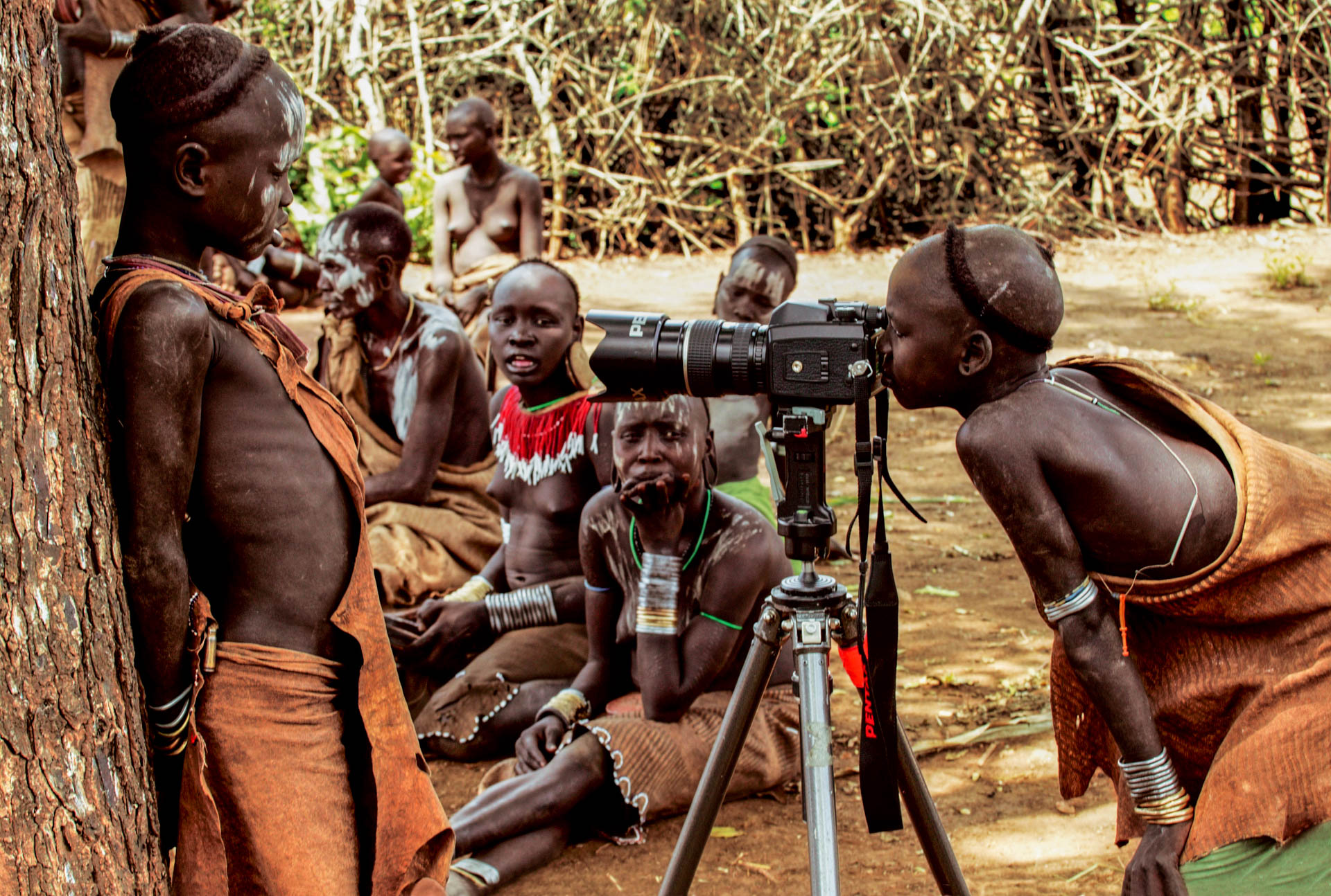 The Mursi are very curious: this child can't resist the temptation of looking through the camera.