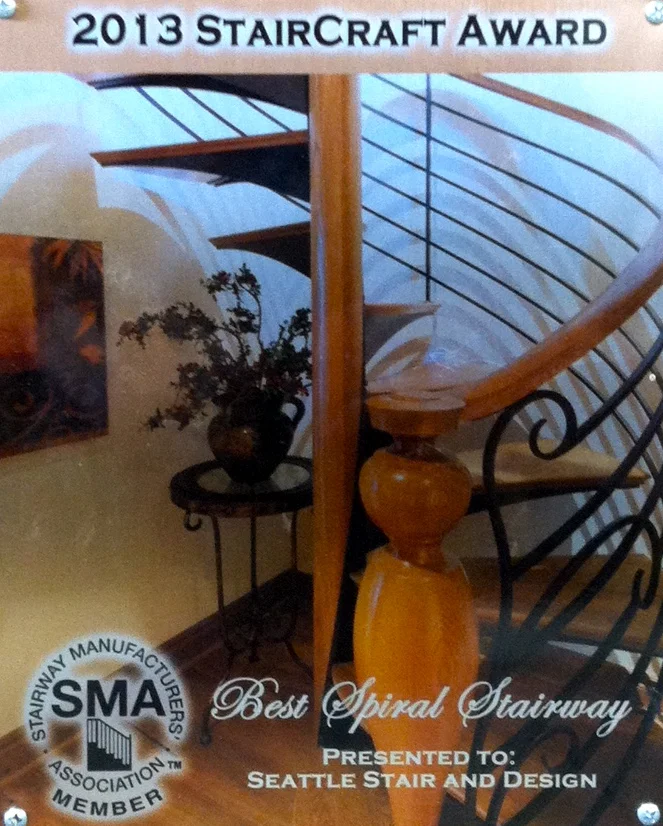 Seattle Stair & Design's white oak and hand forged blackened steel stair won Best Spiral Stair at the 2013 SMA Awards. The spiral stair complements a winding main stair that recently won second place for most innovative design component at the 14th Annual Northwest Design Awards.