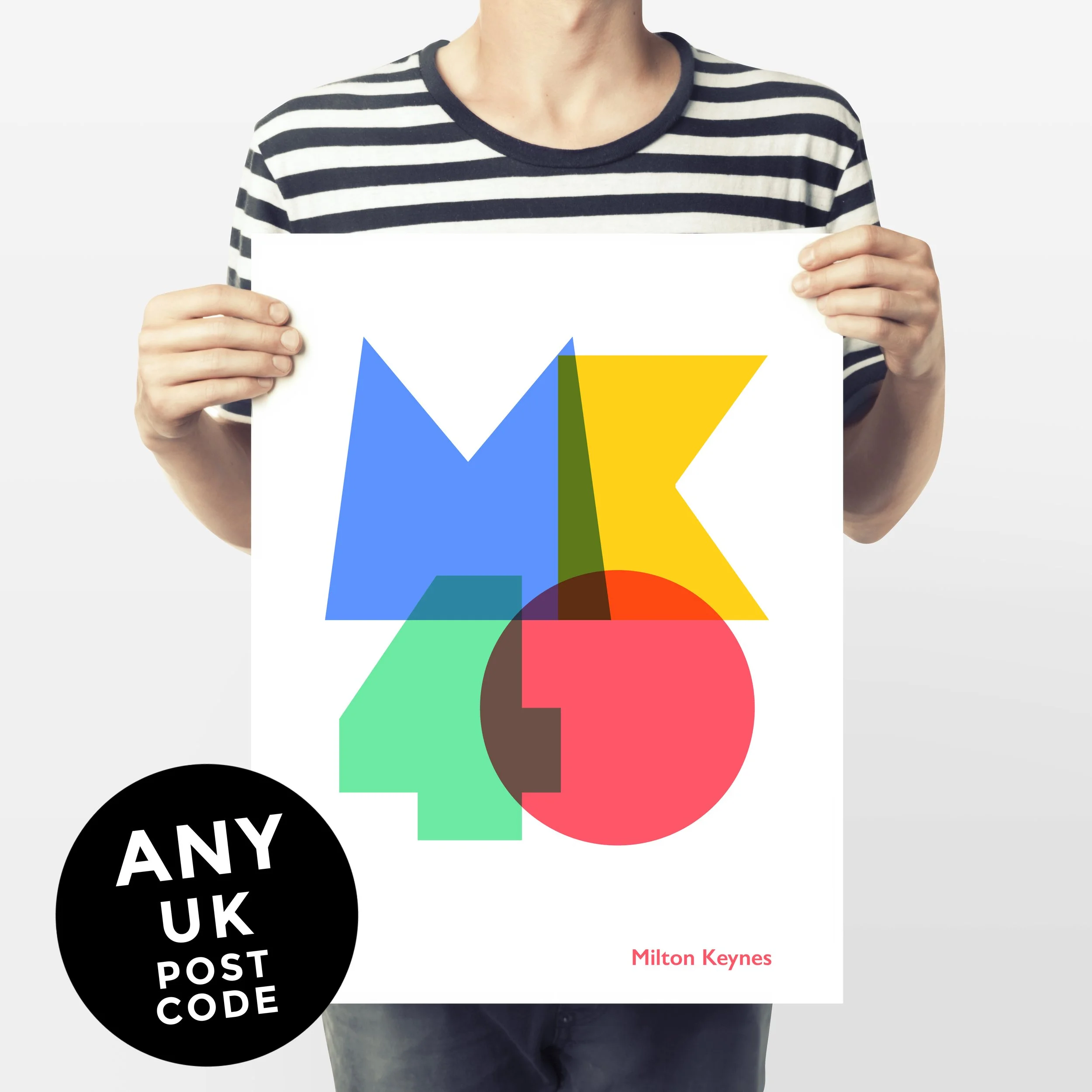 Man olds an A3 print depicting a UK post code in large, colourful typography and it has a note stating: Any UK post code