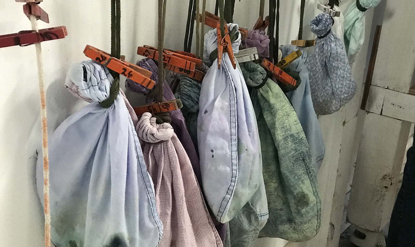 Bird bags hanging by the banding table. The birds are very calm in the bags.