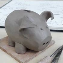 Piggy Banks with 'Drawn and Fired'.