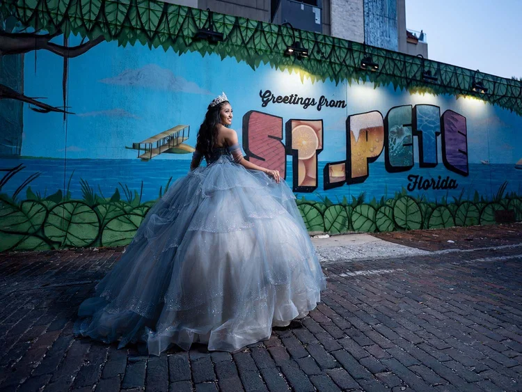 Quinceañera portrait in front of the Greetings from St. Pete mural, by Henry M Production