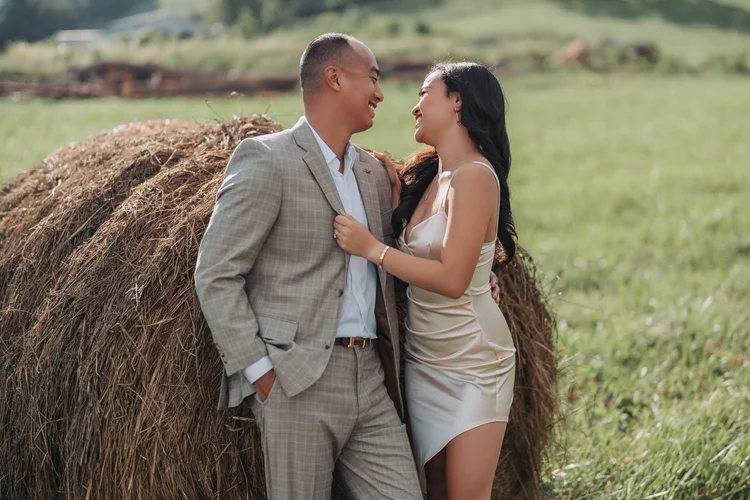 Engagement photos by a countryside hay bale, by Henry M Production