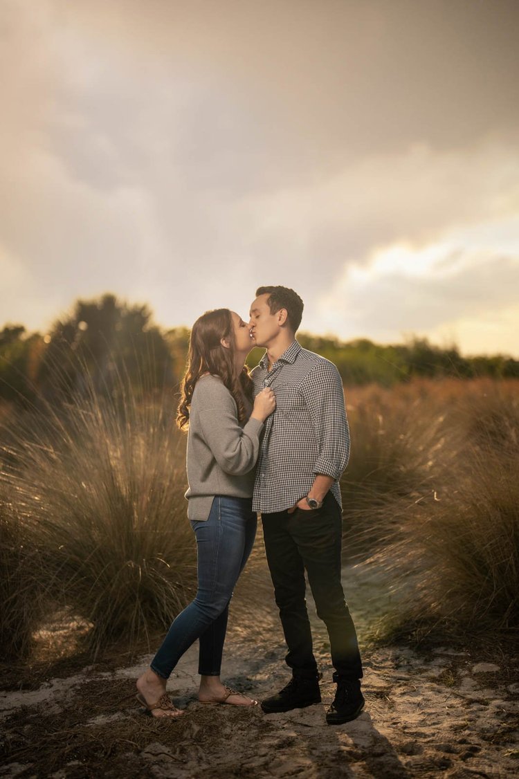 Engagement photos in a golden grass field, by Henry M Production