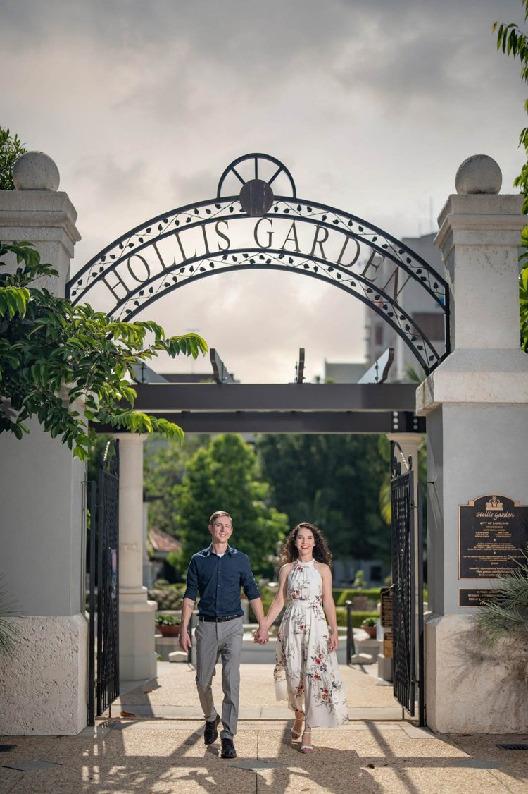 Engagement photos at a garden entrance, by Henry M Production