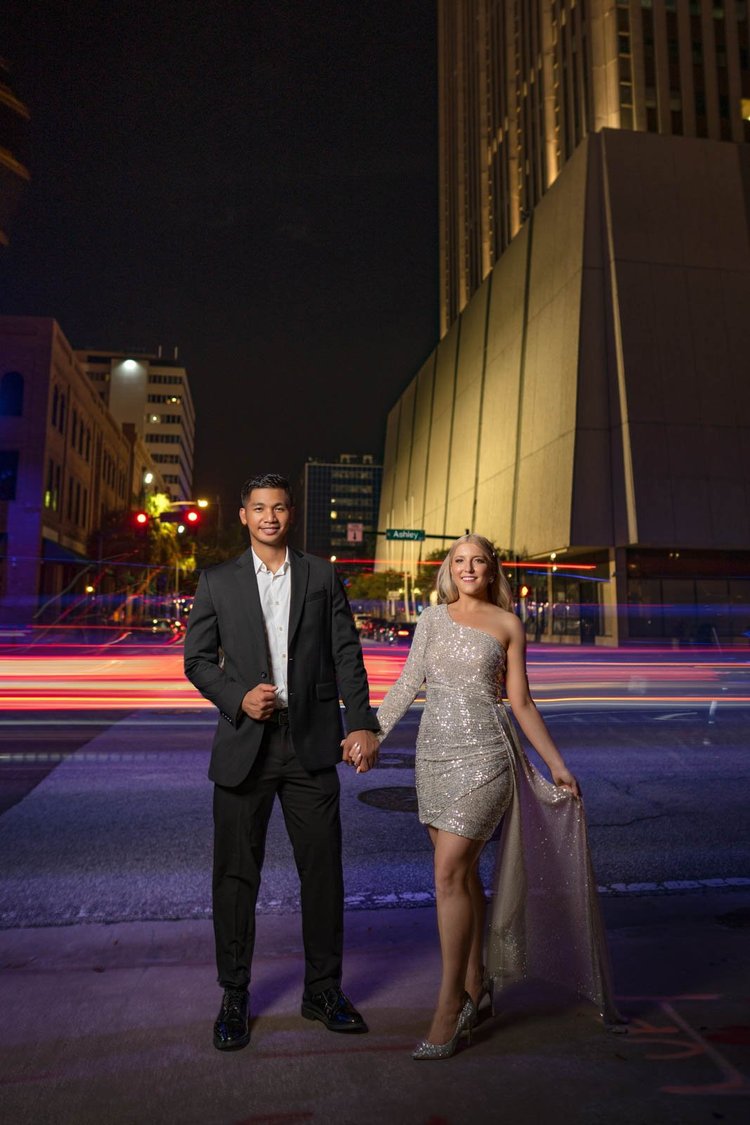 Engagement photos among city lights, by Henry M Production