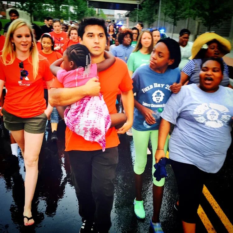 RePublic's Ravi Gupta and Abigail Rockey march alongside families from Liberty Collegiate Academy.