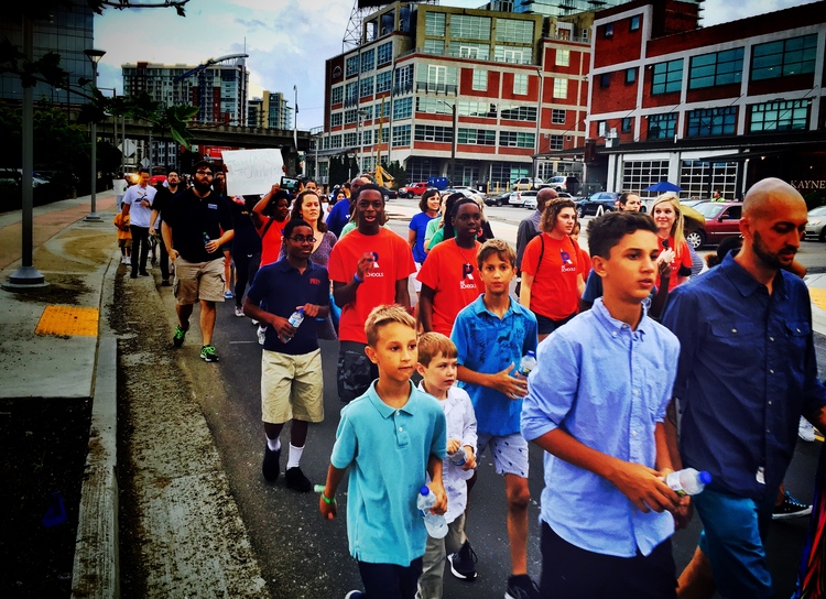 The crowd marched down 12th Avenue South and through the Gulch amidst the support and encouragement of onlookers.