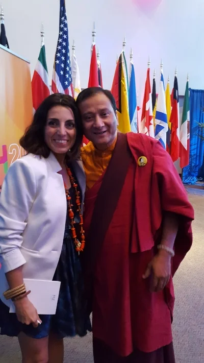 Silvia Garcia with a member of Bhutan , the first country to measure their progress using Gross Happiness Product instead of GDP