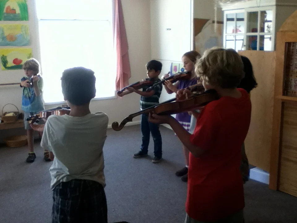 Children are also expected to learn traditional string and wind instruments as they mature musically.
