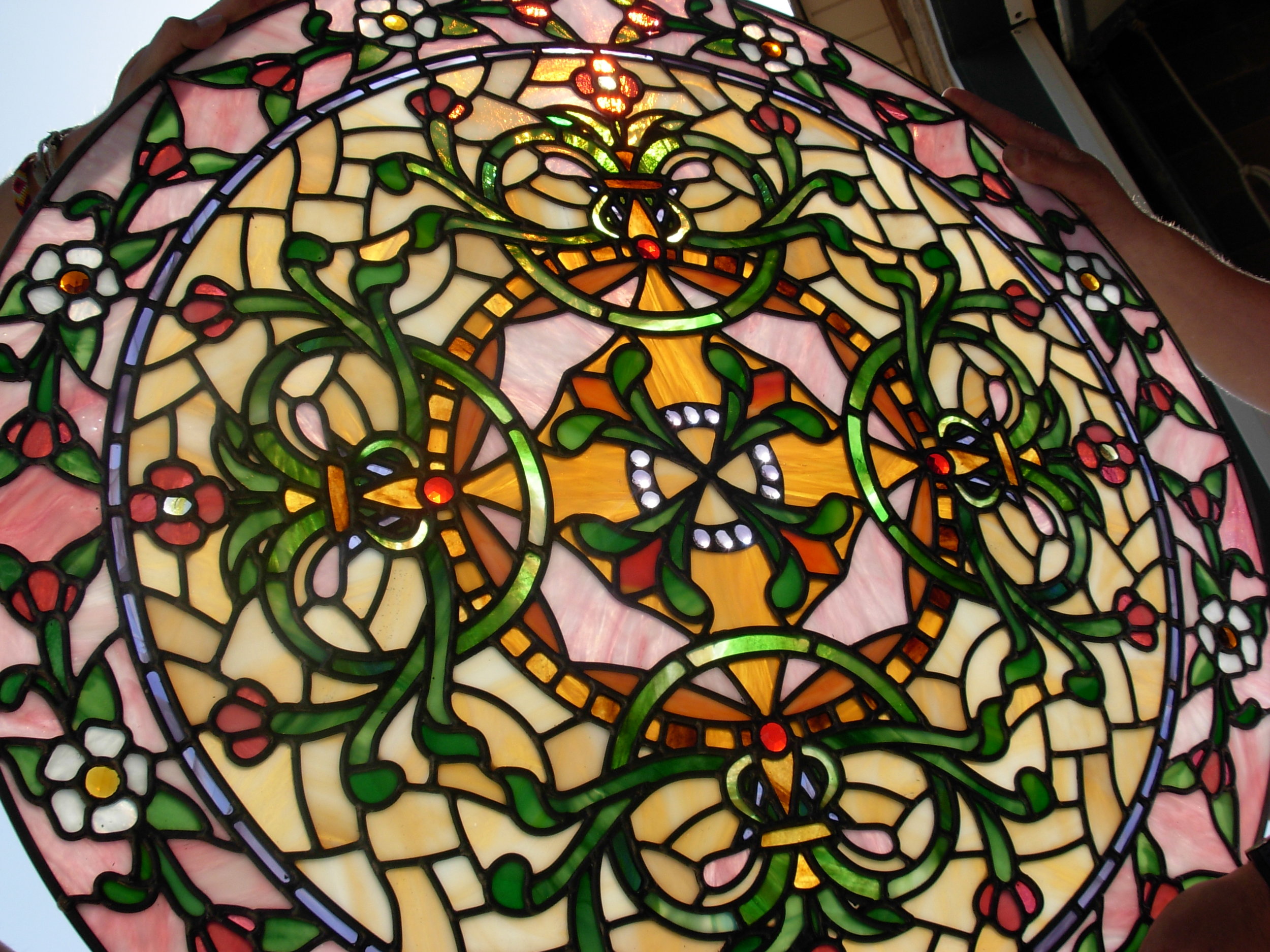We build stained glass in any shape and size, blending natural stained glass with painted glass, in beautiful color pallets. 