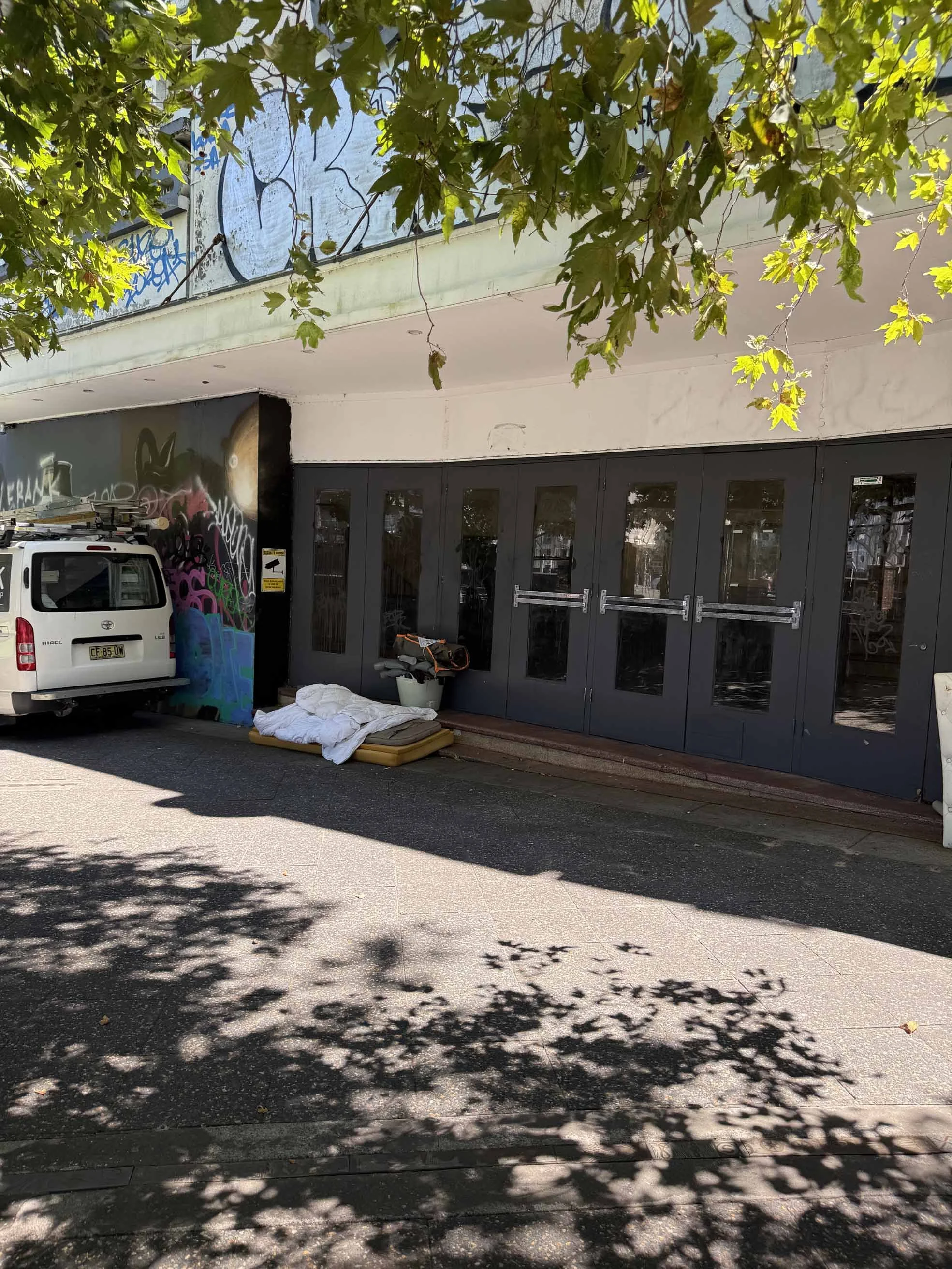 The stairs of the Hub Theatre building are a place to sleep overnight.  