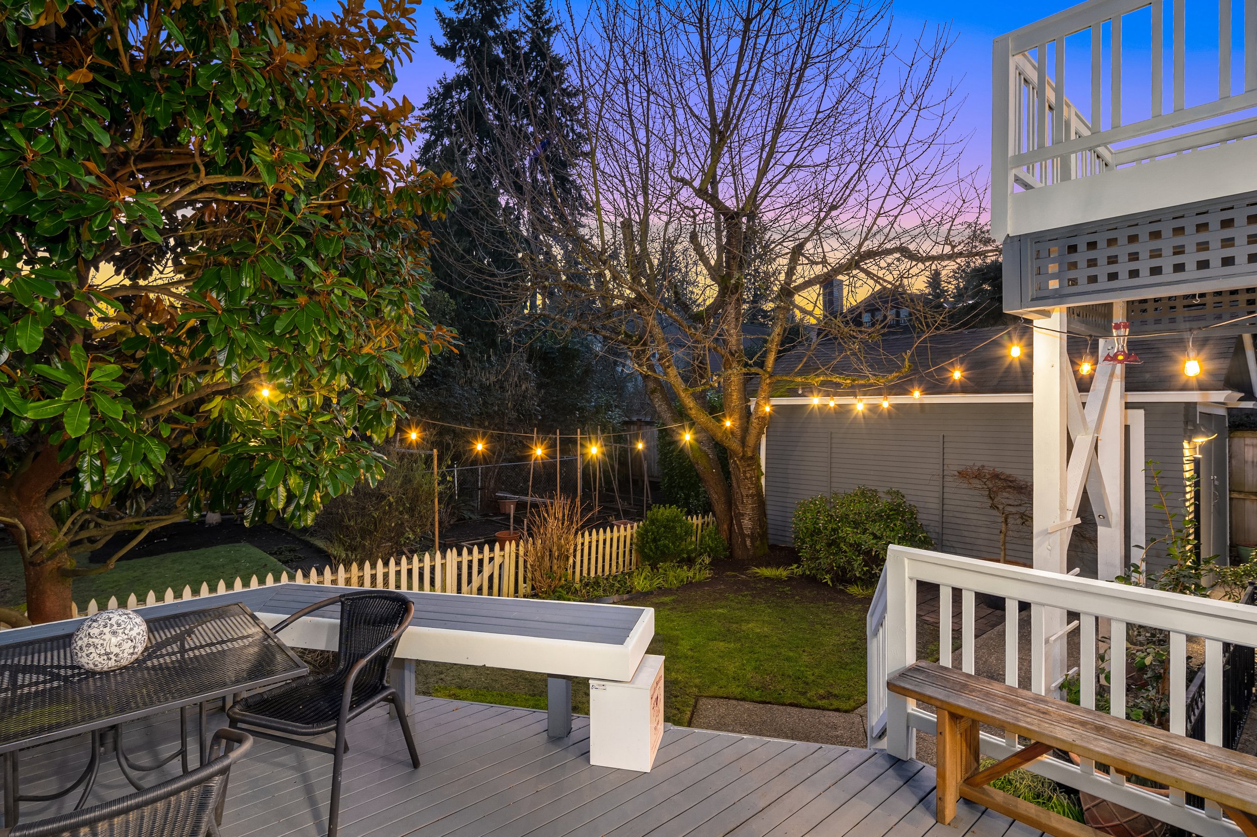  Deck off the kitchen ensures indoor|outdoor living comes full circle, offering inviting spaces for dining al fresco. The garden offers plenty of space for those with a green thumb. 