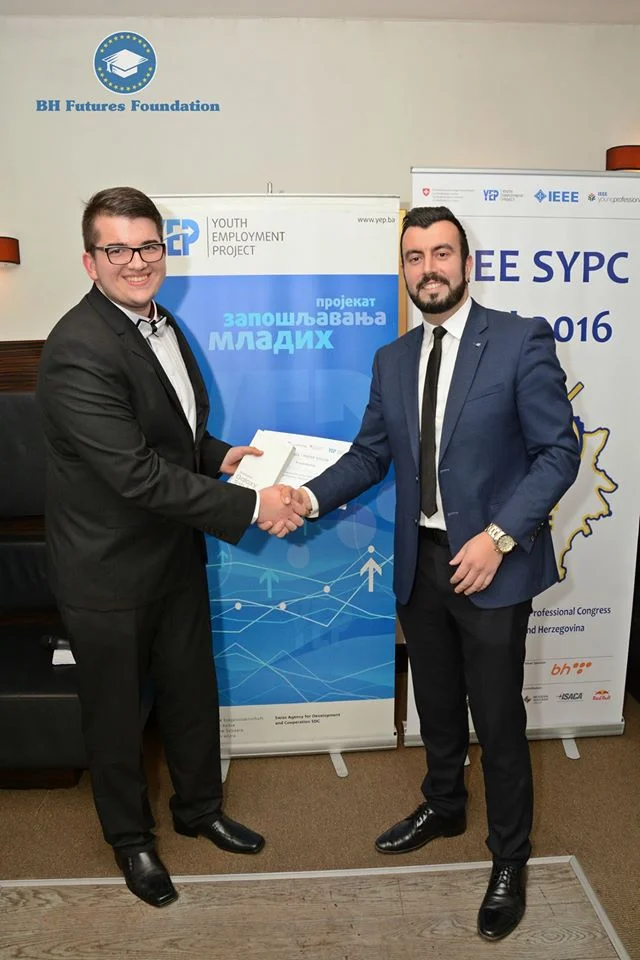 Dalibor Djumic receiving the 1st place award from Bosnia & Herzegovina Futures Foundation Founder & Chair Dr. Edhem (Eddie) Custovic.