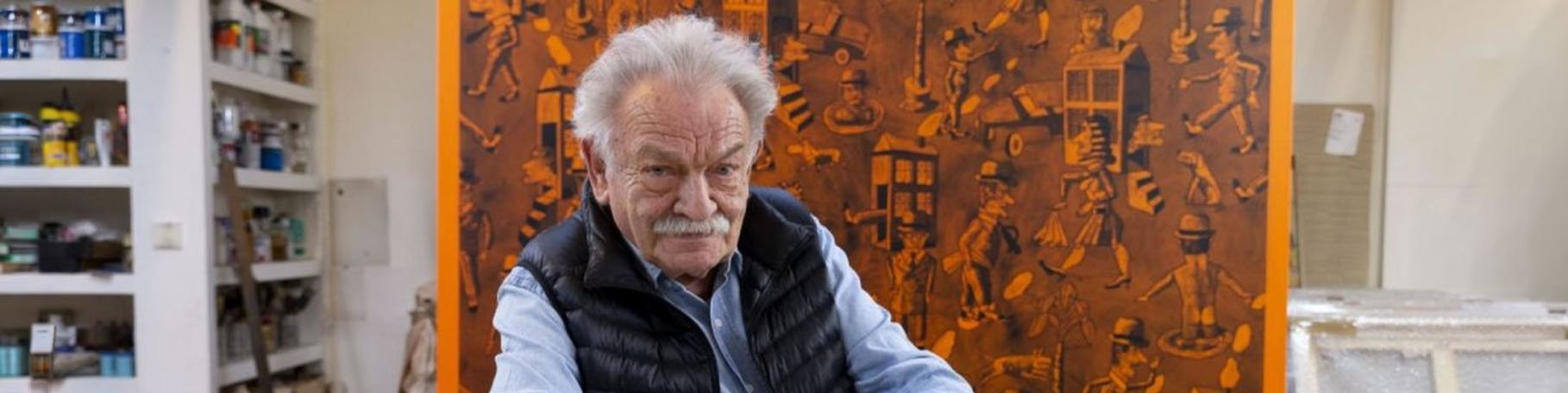 Antonio Seguí in his studio surrounded by his paintings