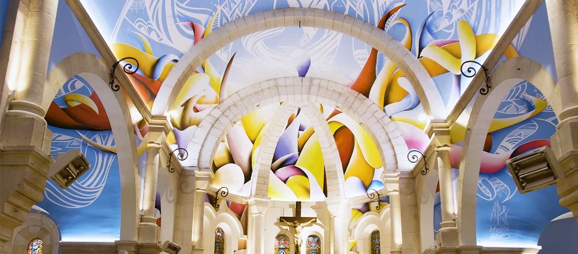Amaury Dubois mural inside St Madeleine's Church featuring his colorful Curvism