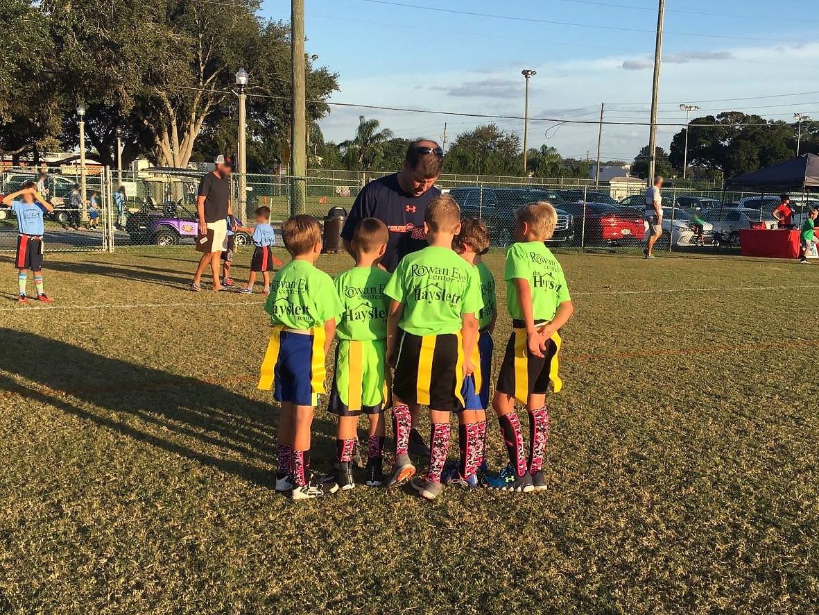 Tom coaching youth sports