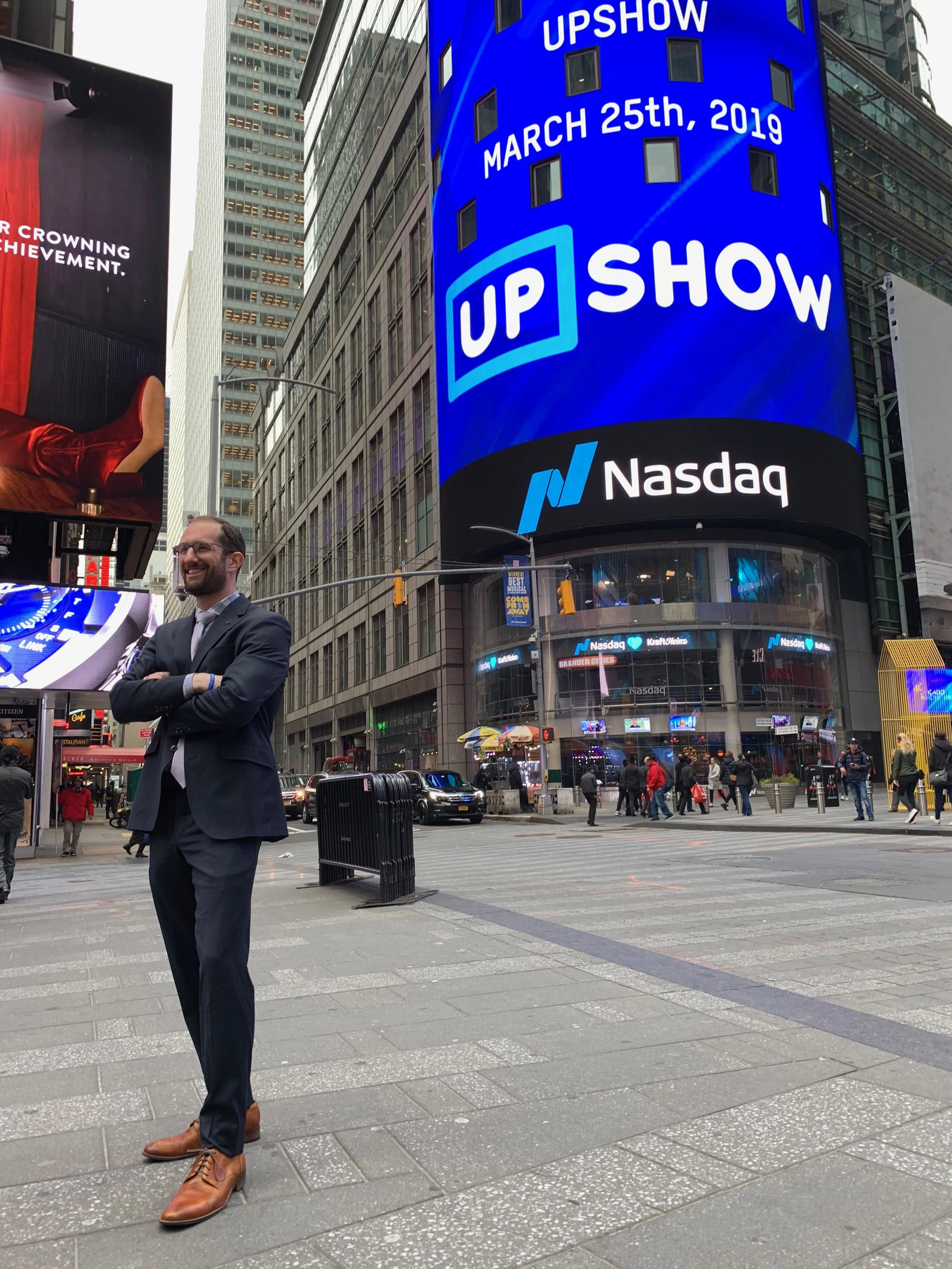 The UPshow logo displayed proudly in Time Square.