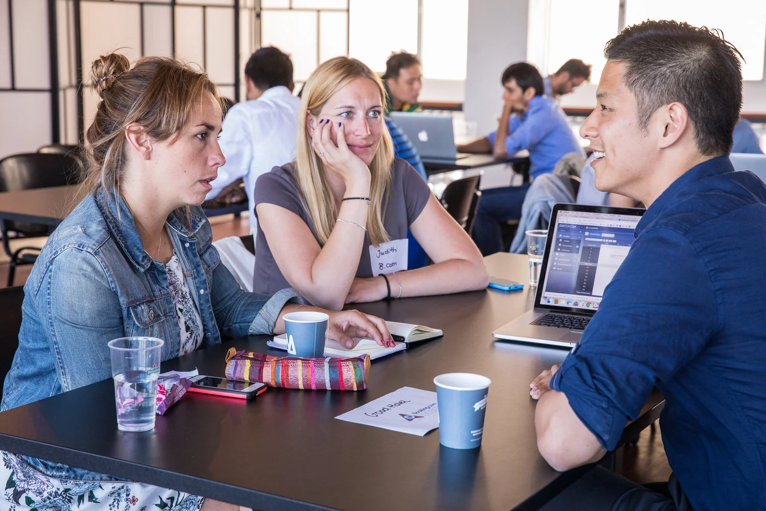 Cristina of Good Hotel with her Booking.com mentor, Judith Figas, in conversation with Jeff Pan during the tech consulting sessions at TQ in Amsterdam