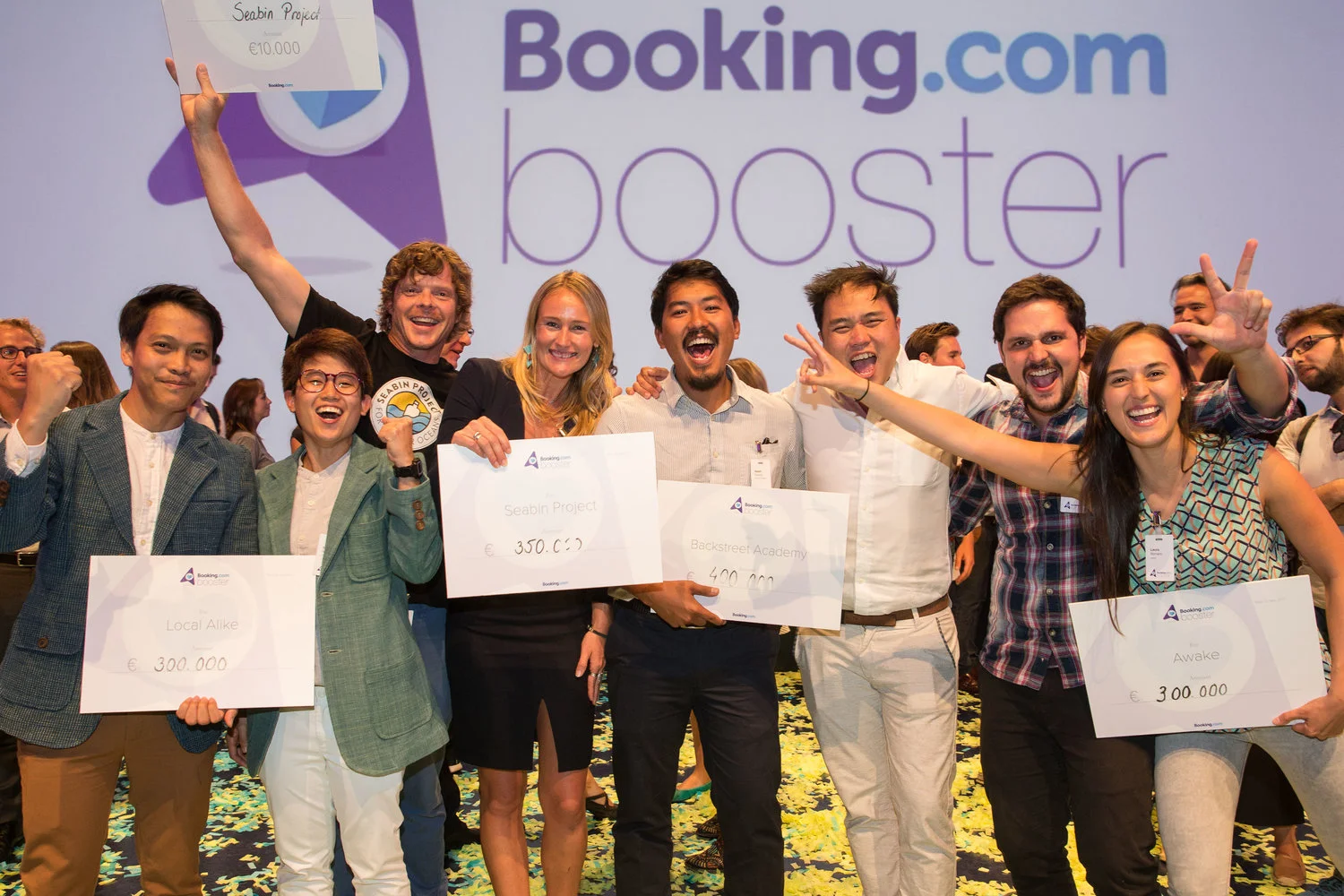 Teams of Local Alike, Seabin Project, Backstreet Academy, and Awake celebrating