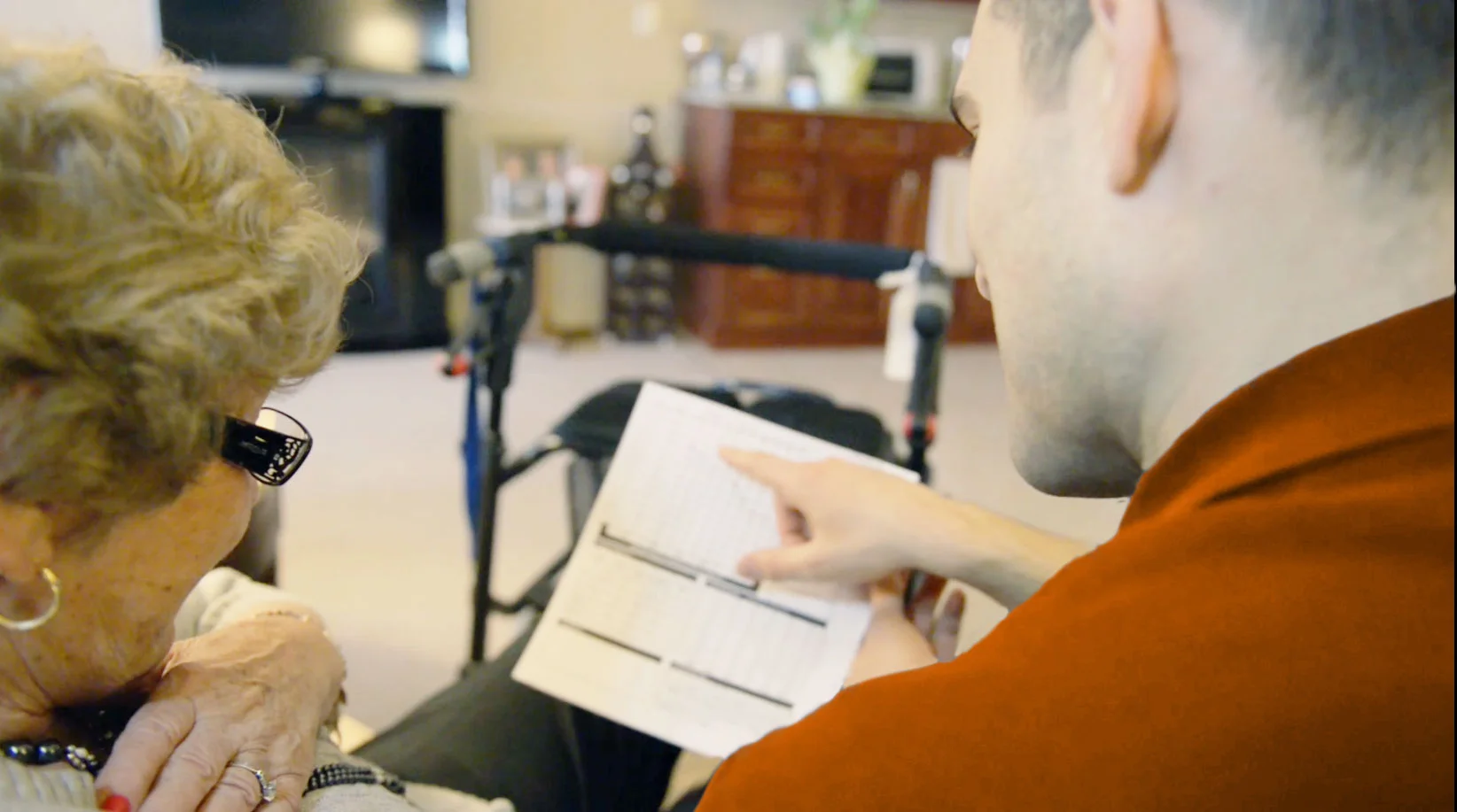 Patient getting his hearing testing in his own home by an Audiologist.