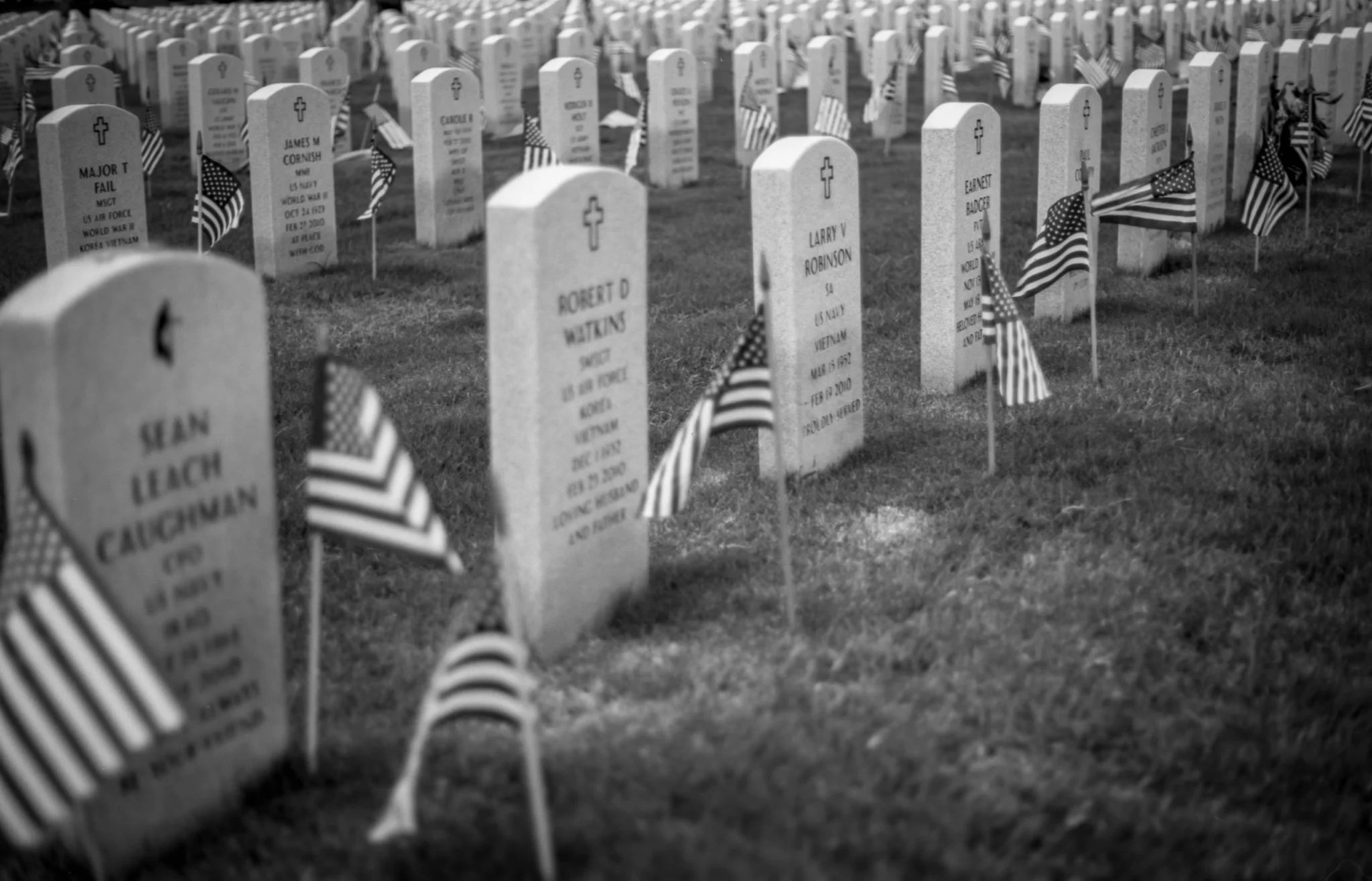 Grave Markers with small American flags on the grounds of DFW VA National Cemetery.