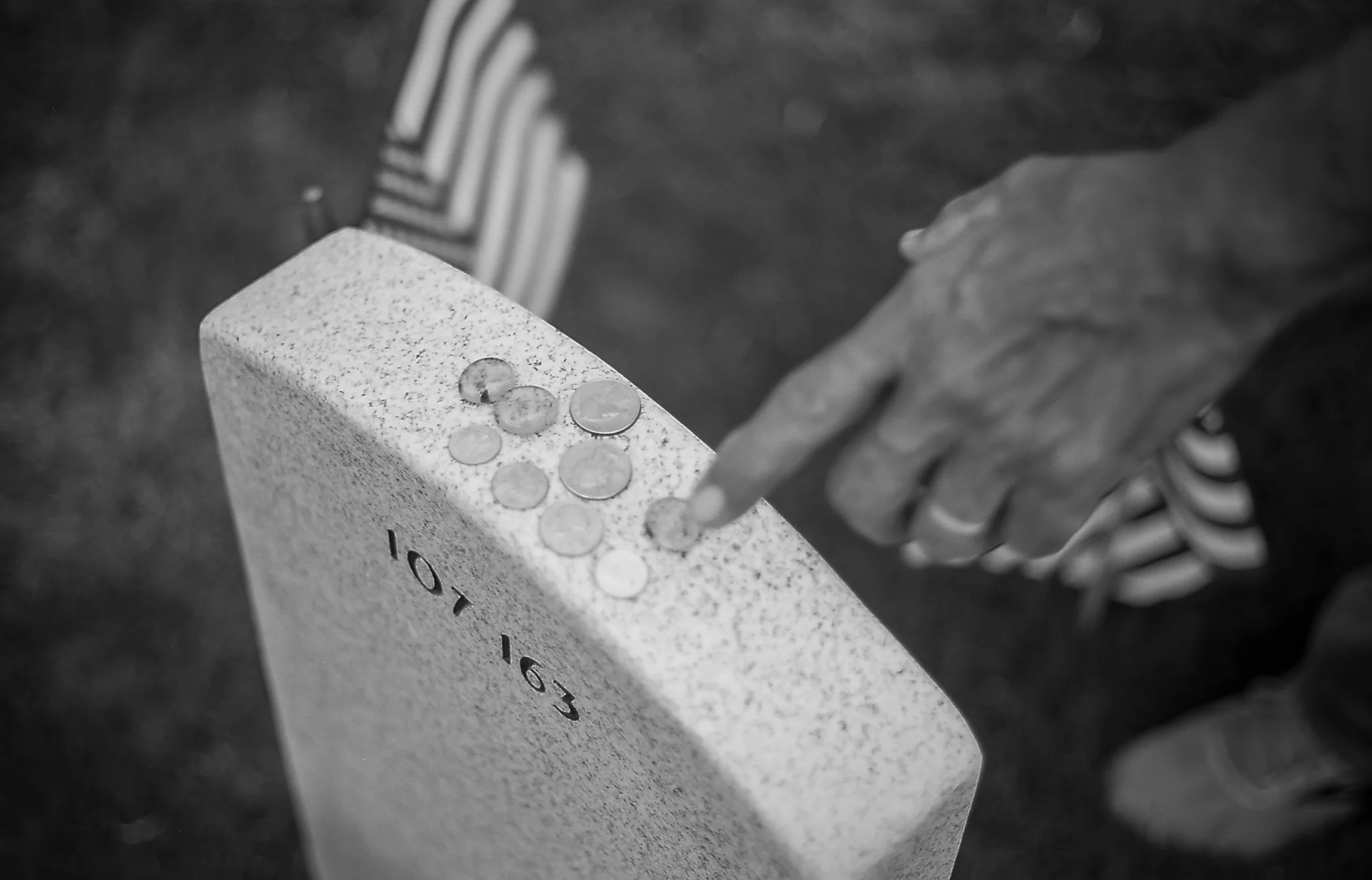 A vistor explaining to me the meaning of the various coins he has placed on a Grave Marker.