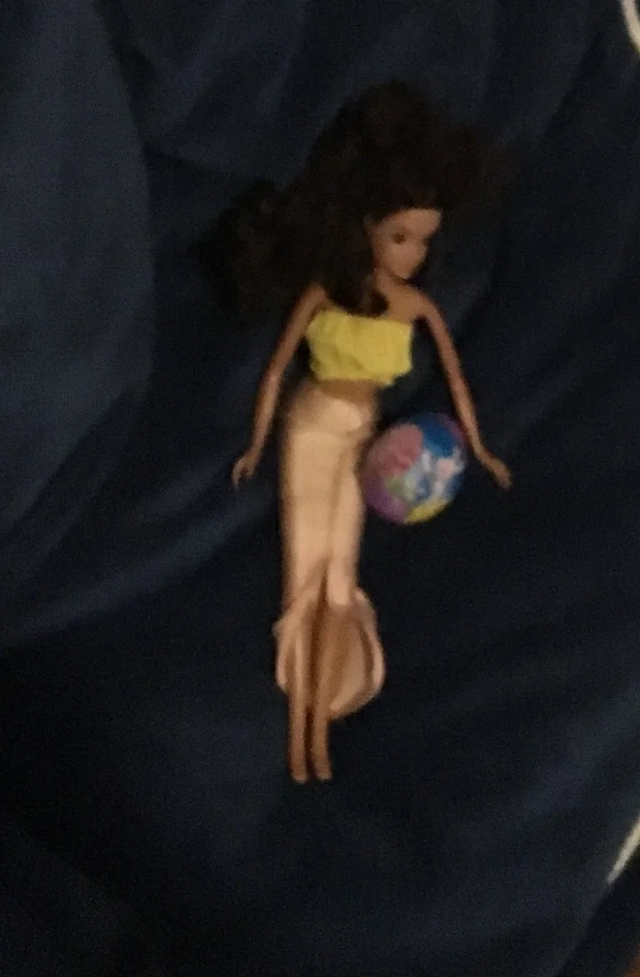 I hastily took photos of where I hid the eggs. I ran out of ideas and said, "Here, Barbie. Hold this a tic."