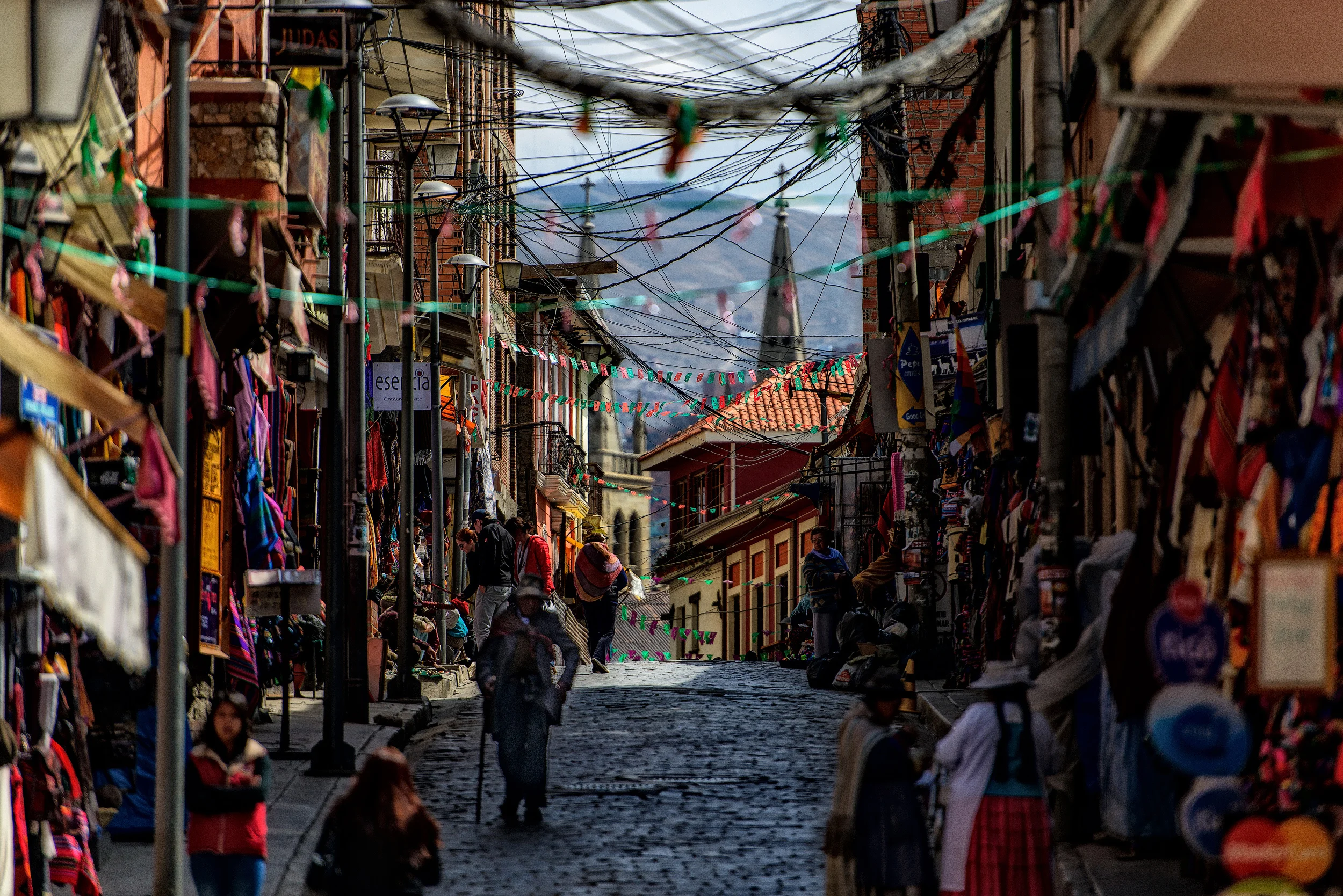 La Paz Downtown La Paz is a warren of tiny streets and markets with the whole city surrounded by the towering peaks of the Cordilliiera Real