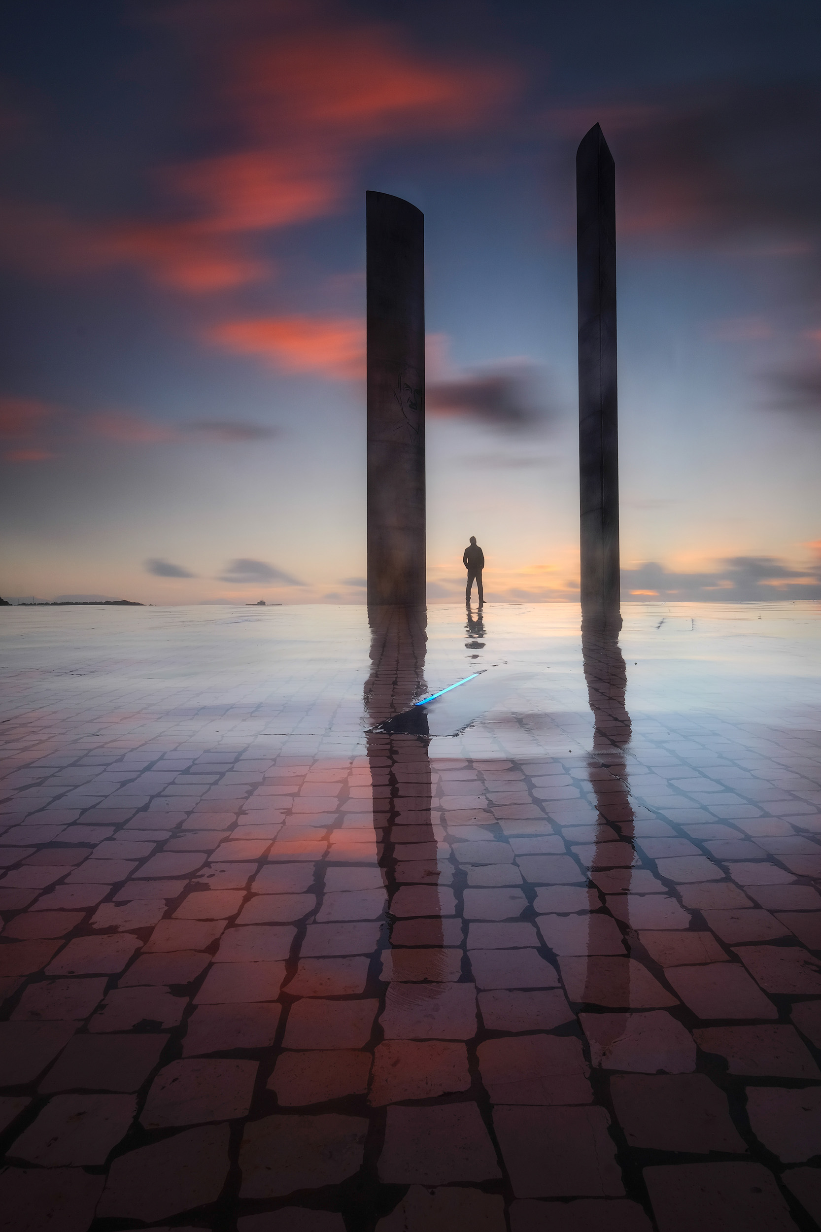 Champalimaud Self Portrait Rainfall created a slick surface on the stones which made it possible to shoot reflections as the sun set at Fundaçao Champalimaud in Lisbon. After shooting the image and reviewing it on my camera, I realised it needed a sense of scale, and so set the camera's self timer up and shot the image again as a self portrait.
