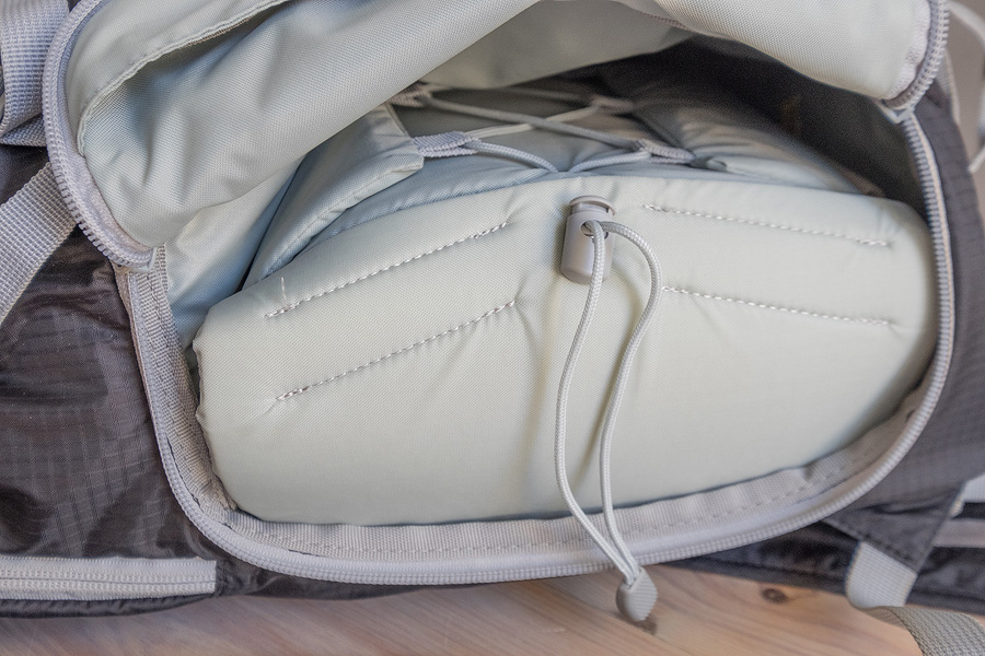 The camera compartment with drawstring pulled tight