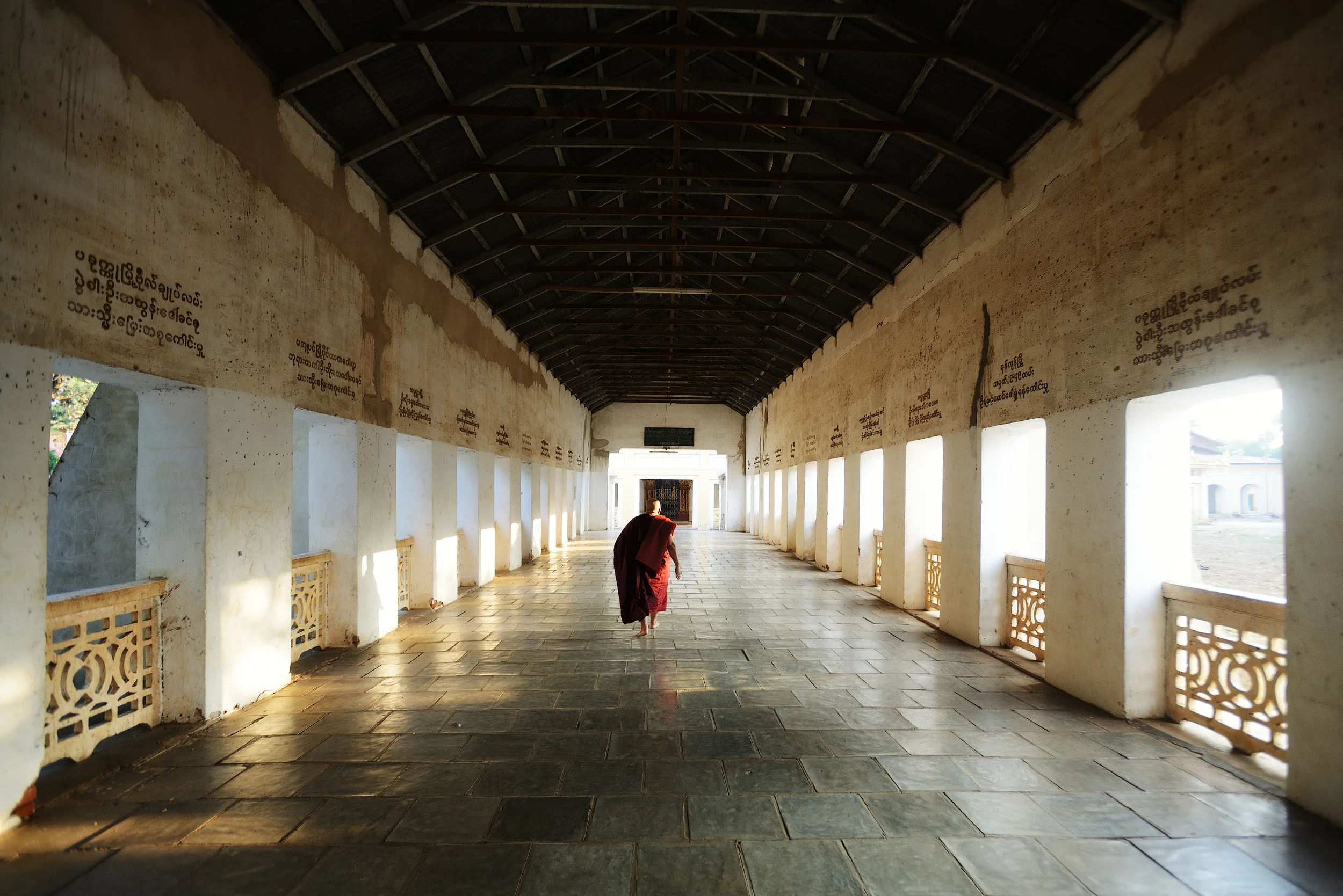 Shwezigon A monk walks along the corridor at Shwezigon Pagoda, Bagan