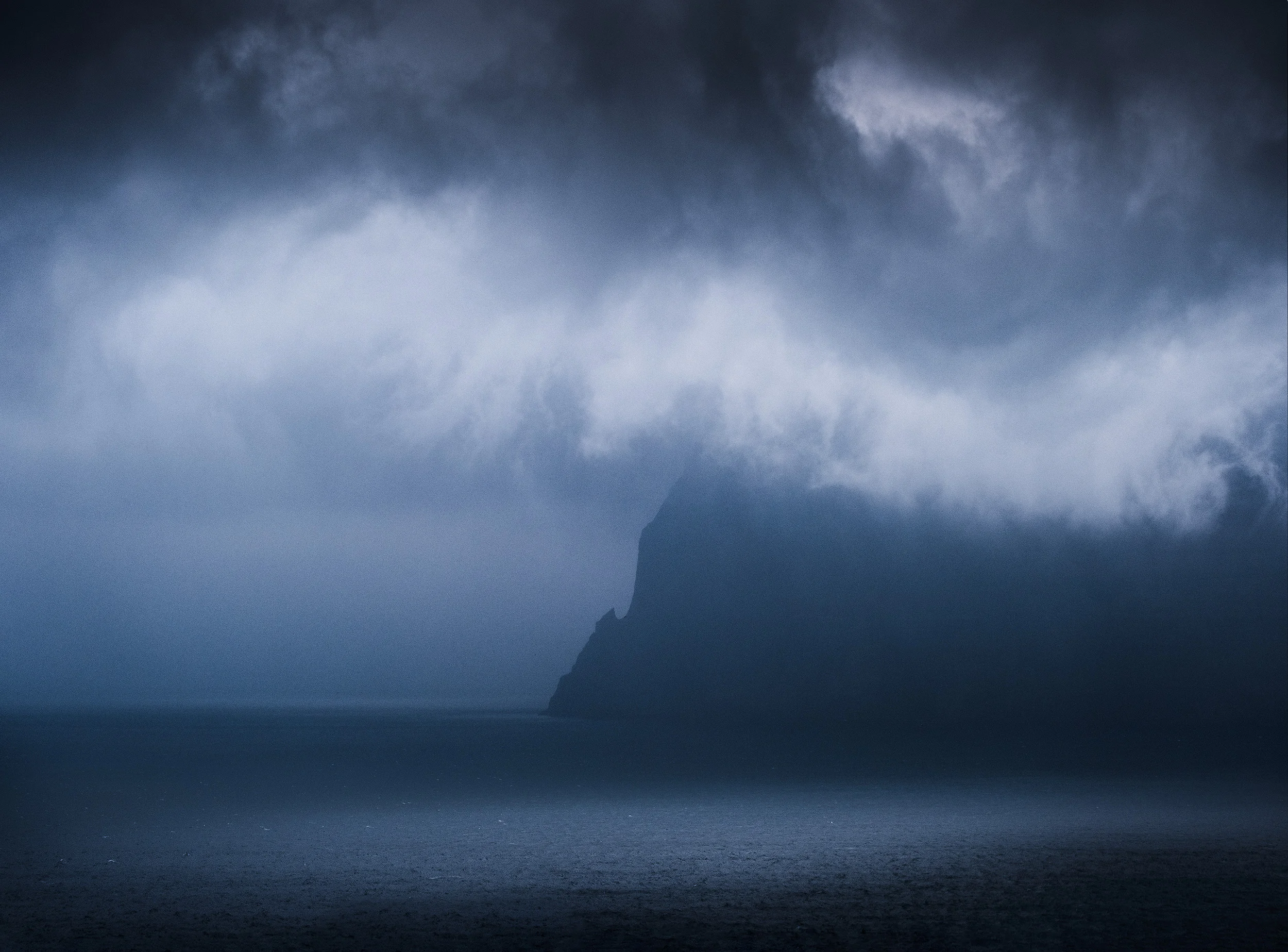 Kunoy Storm clouds around the island of Kunoy, as seen from Trøllanes on neighbouring Kalsoy
