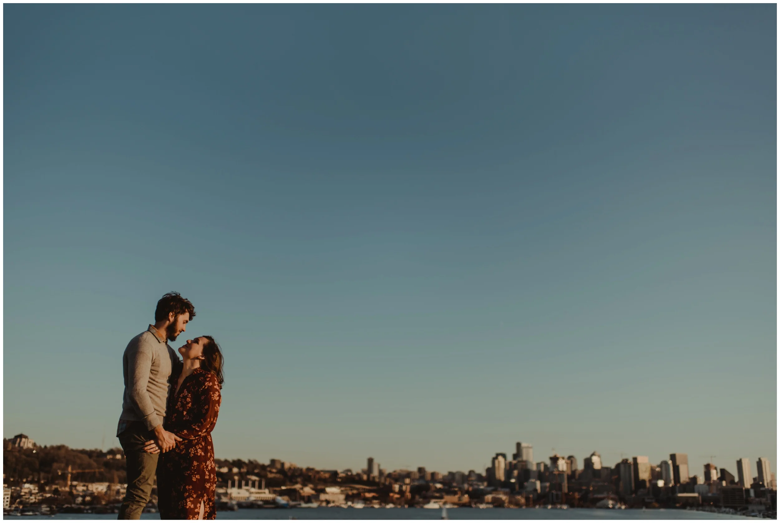 couple looking at each other at sunset | Seattle Engagement Photographer www.riversandroadsphotography.com 