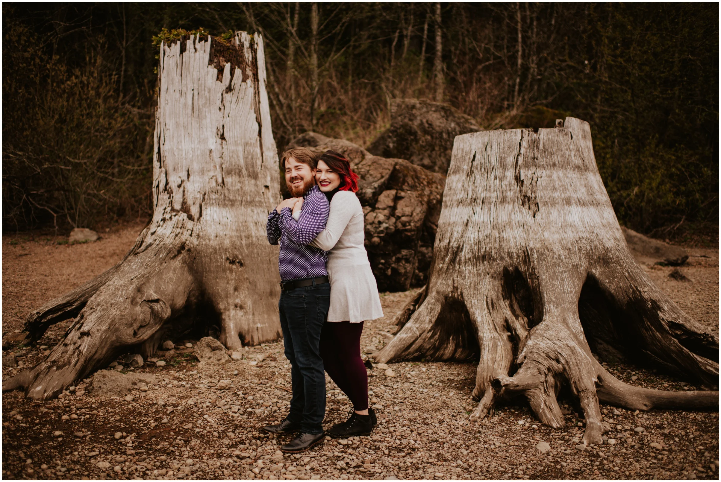 couple cuddling at the lake Rattlesnake Lake, WA | Seattle Wedding Photographer www.riversandroadsphotography.com