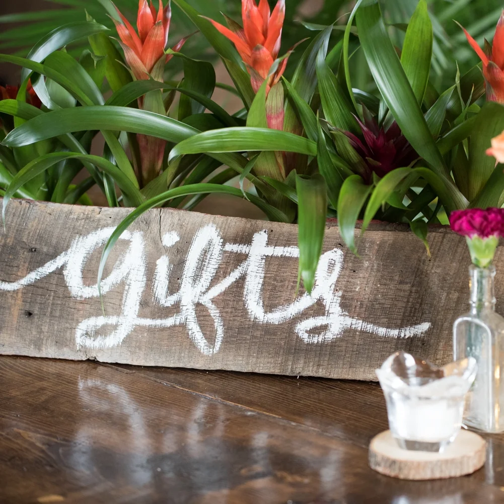 Wooden gifts sign on tropical tablescape