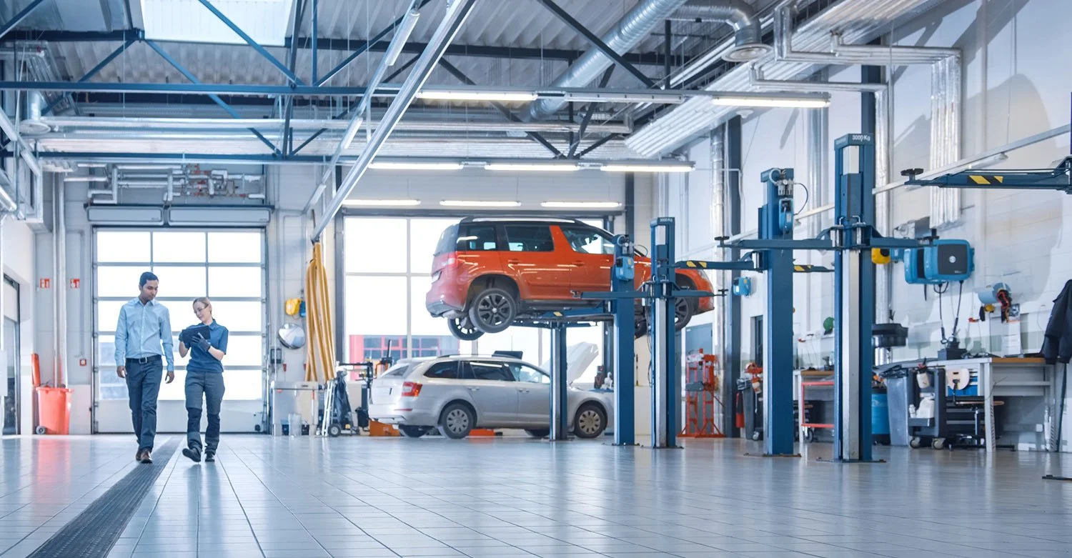 Car on lift in repair shop. Auto repair business insurance. Insurance for auto repair shops. Garagekeepers insurance.jpg
