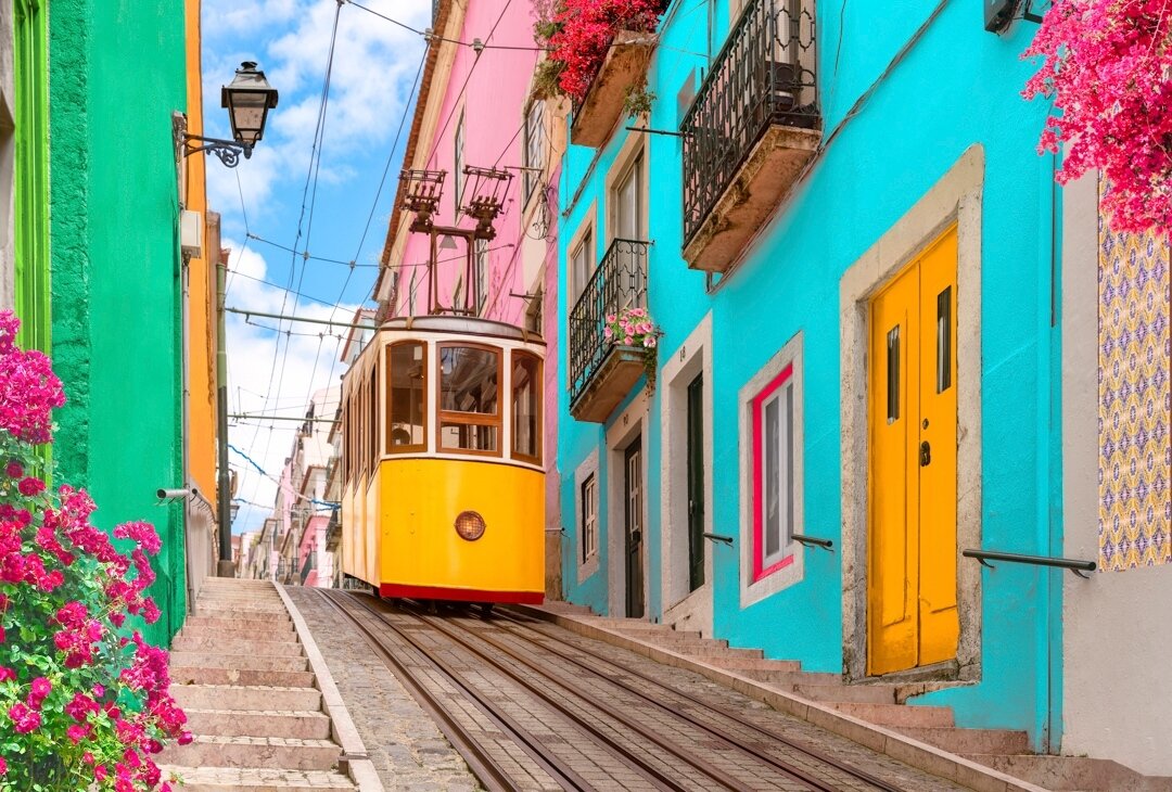 Hit the colorful cobblestones of #Lisbon, Portugal&rsquo;s ever-vibrant capital! ⁠
⁠
Let the soulful melodies of Fado music guide your journey, weave through bustling streets on the iconic Tram 28, and give in to the sweet temptation of Past&eacute;i
