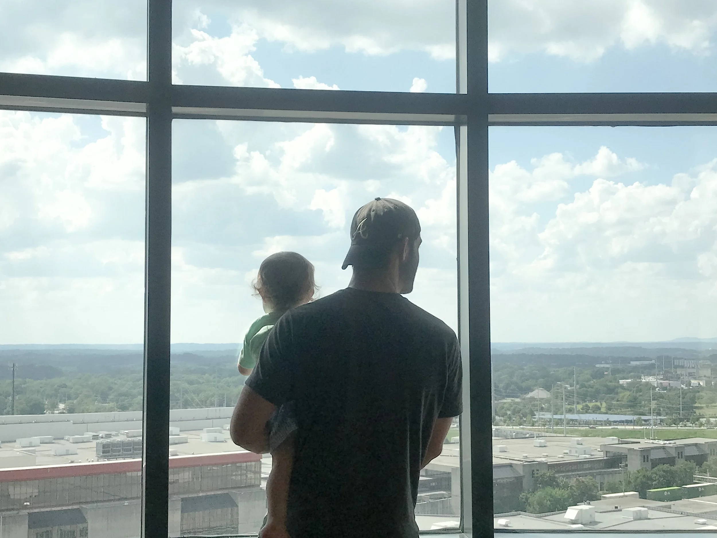 The only picture I took at the first hotel. We had a pretty neat view of the new Mercedes-Benz stadium, the Georgia Dome, and downtown. Also... look at that sweet Daddy's boy ;) 