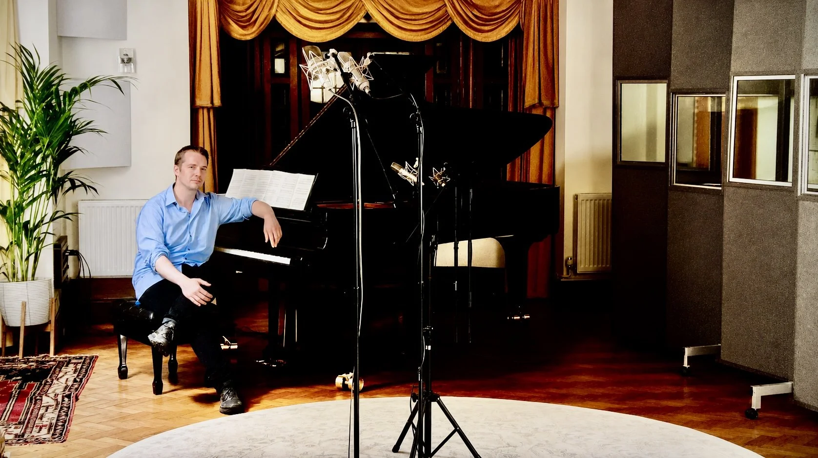 Pianist Daniel Lebhardt with the Steinway Model D in the live room at Curtis Schwartz Studio, with microphones set up for the recording session.