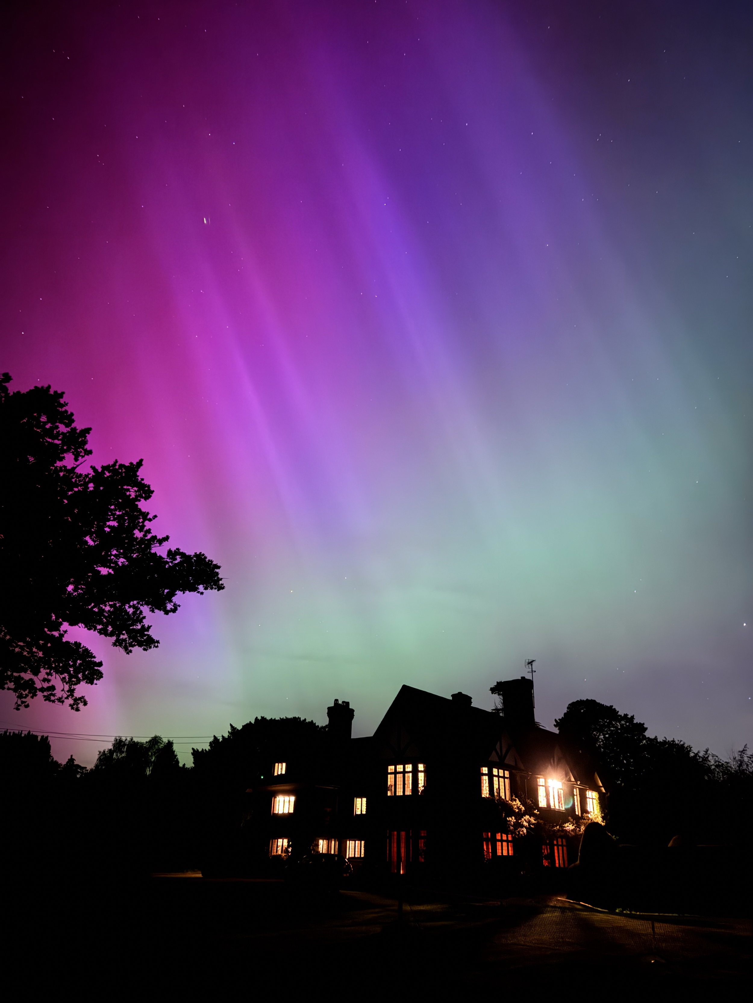 Night view of Curtis Schwartz Studio beneath a vivid aurora borealis during the making of YES’s forthcoming album Aurora.