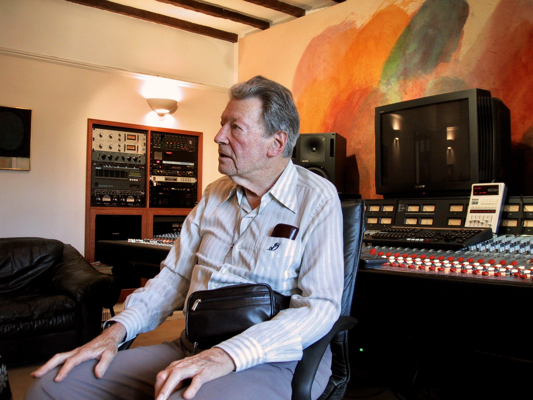 Sid Davis sitting in Curtis Schwartz’s recording studio around 2000. Sid worked for many years as John Wayne’s stand-in and stunt double.