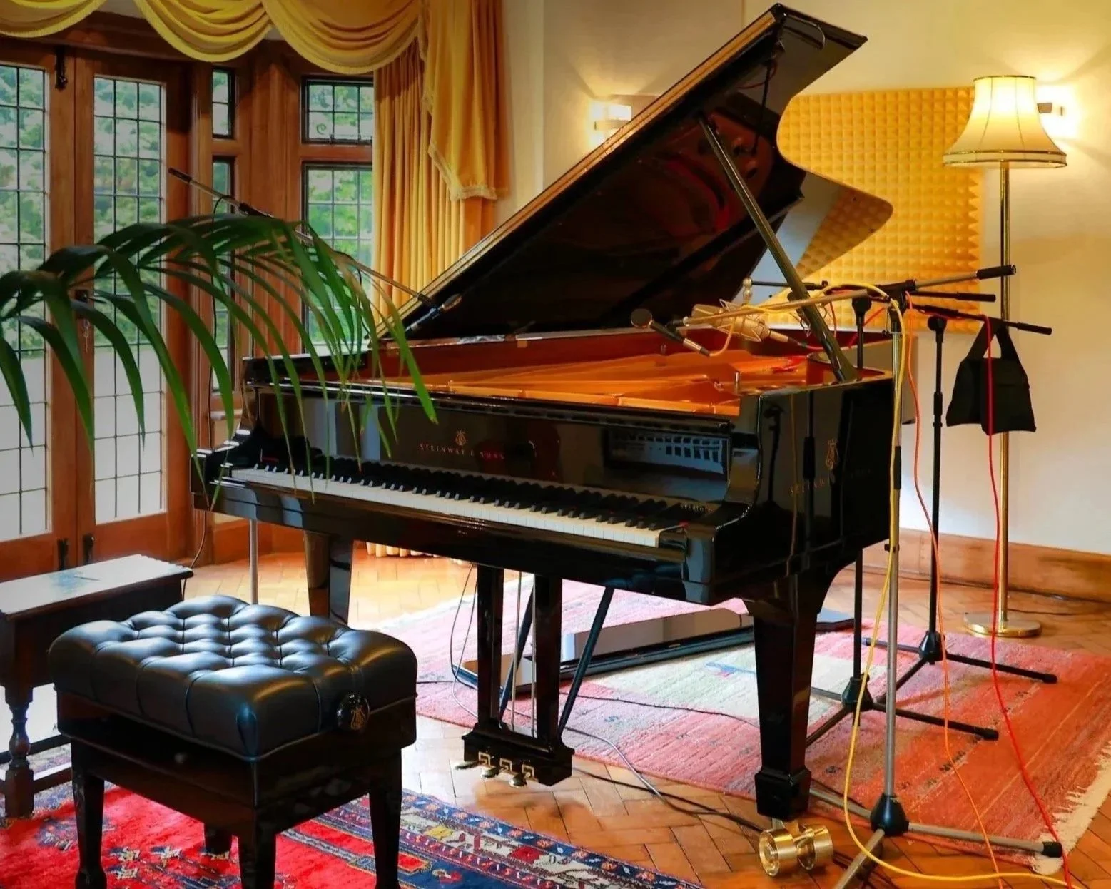 Steinway D Concert Grand piano set up with microphones at Curtis Schwartz Studio in West Sussex.