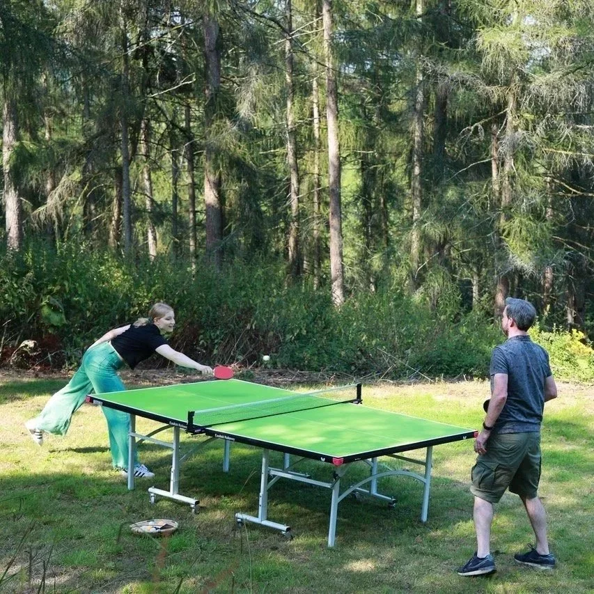 Gwilym Simcock and Emma Rawicz playing table tennis in the garden during a break from recording at Curtis Schwartz Studio.