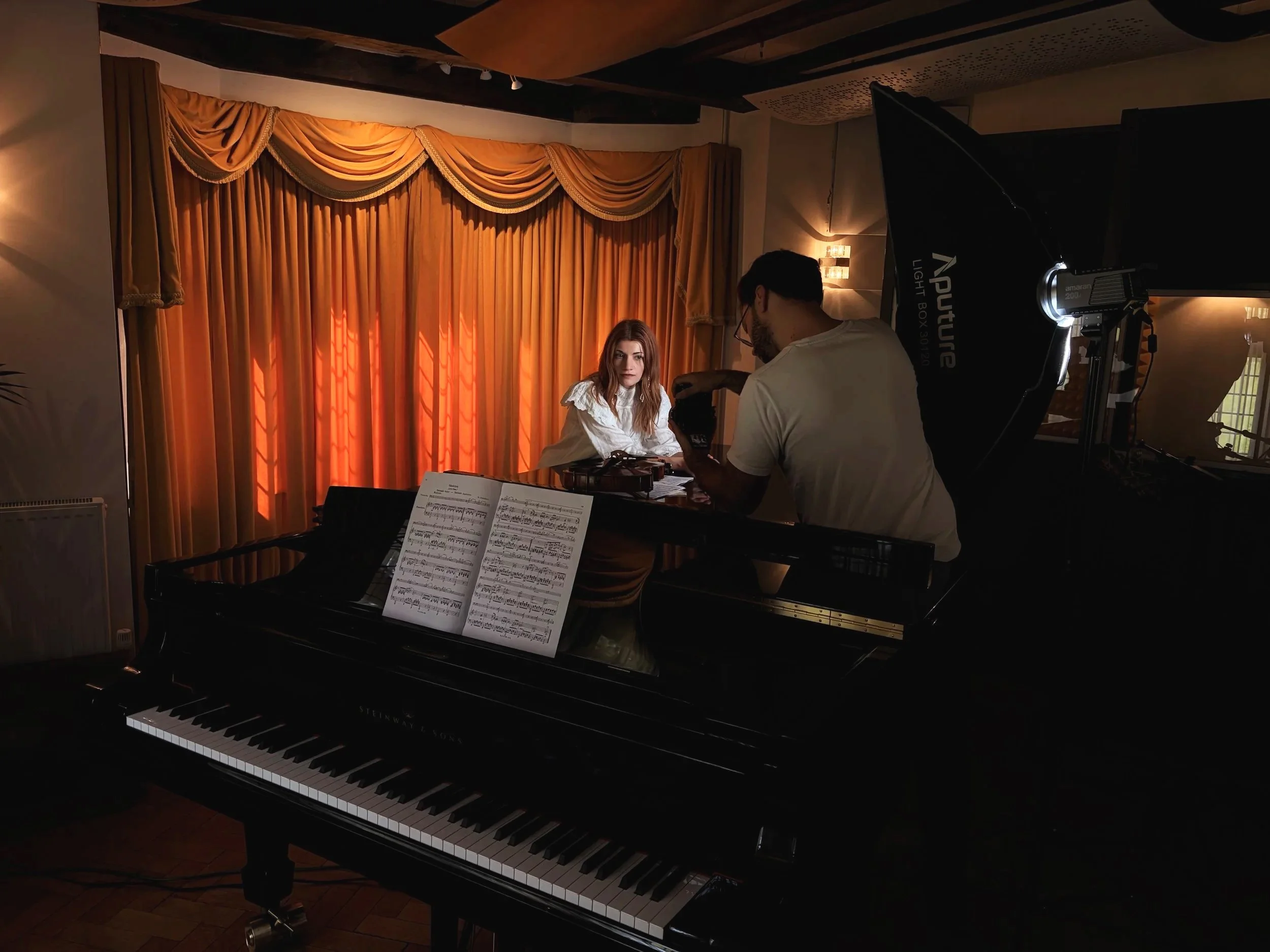 Behind-the-scenes filming during Knarika Karapetjana and Daniel Lebhardt’s recording session at Curtis Schwartz Studio, with the Steinway Model D, sheet music and studio lighting in the live room.