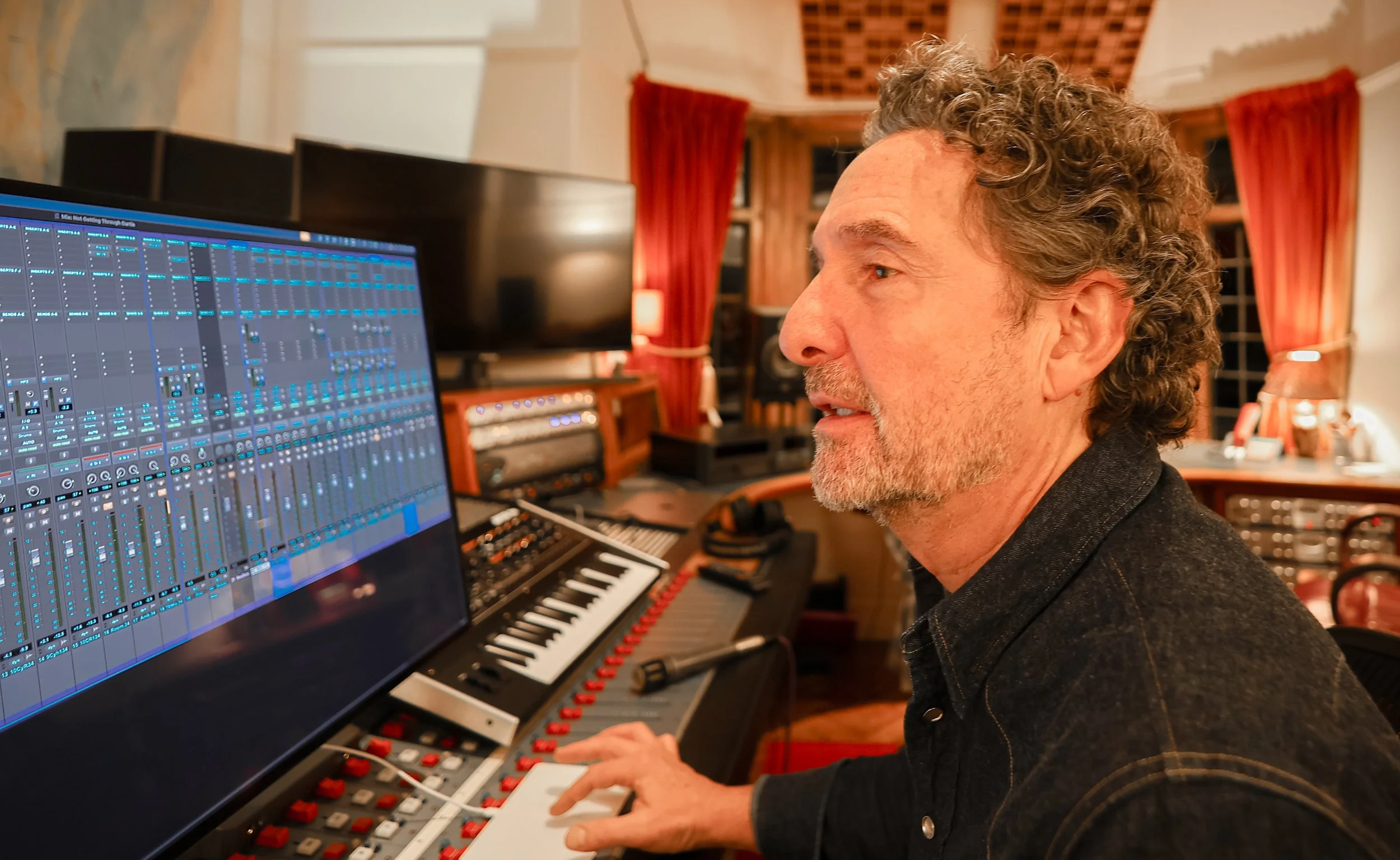 Curtis Schwartz working at the mixing desk during the making of Yes’s album Aurora.