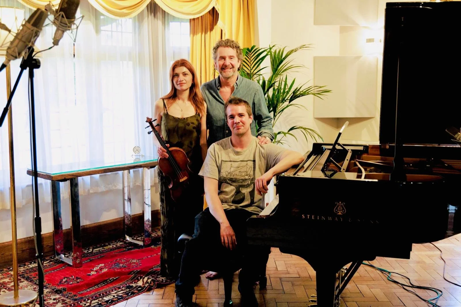Knarika Karapetjana, Curtis Schwartz and Daniel Lebhardt beside the Steinway Model D in the live room at Curtis Schwartz Studio after completing their viola and piano recording sessions.