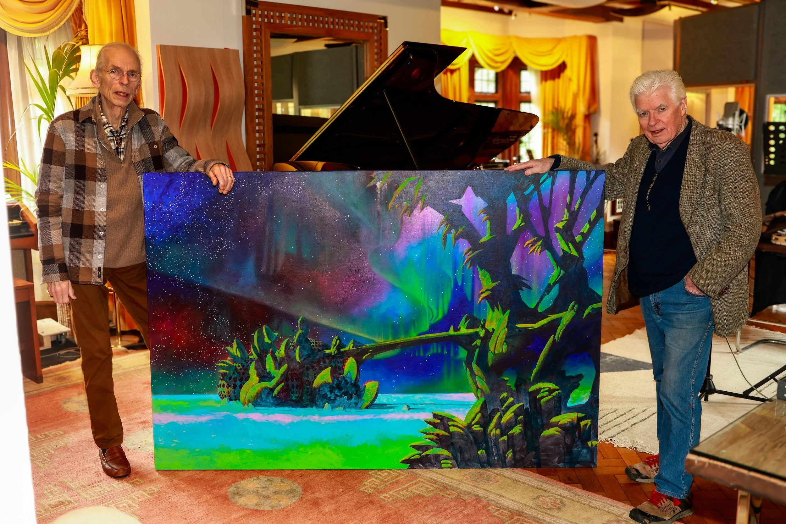 Roger Dean and Steve Howe standing in Curtis Schwartz Studio with the original painting for YES’s forthcoming album Aurora.