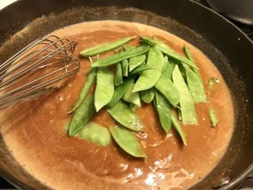 I add the snow peas here instead of steaming separately. Otherwise, it's not a true one pot meal!!