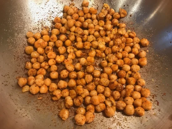 Can of chickpeas drained and rinsed with some garlic powder smoked paprika, cayenne pepper and I added some chili powder as well. Saute' 5 minutes in a skillet with olive oil and add to the salad. A great source of soluble fiber to help with cholesterol lowering!